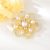 Arannyal bevont exkluzív gyöngyös virág bross áttetsző cirkónia kristályokkal (0564.)