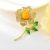 Arannyal bevont virágszál bross pezsgőszínű cirkónia kristályokkal (0766.)