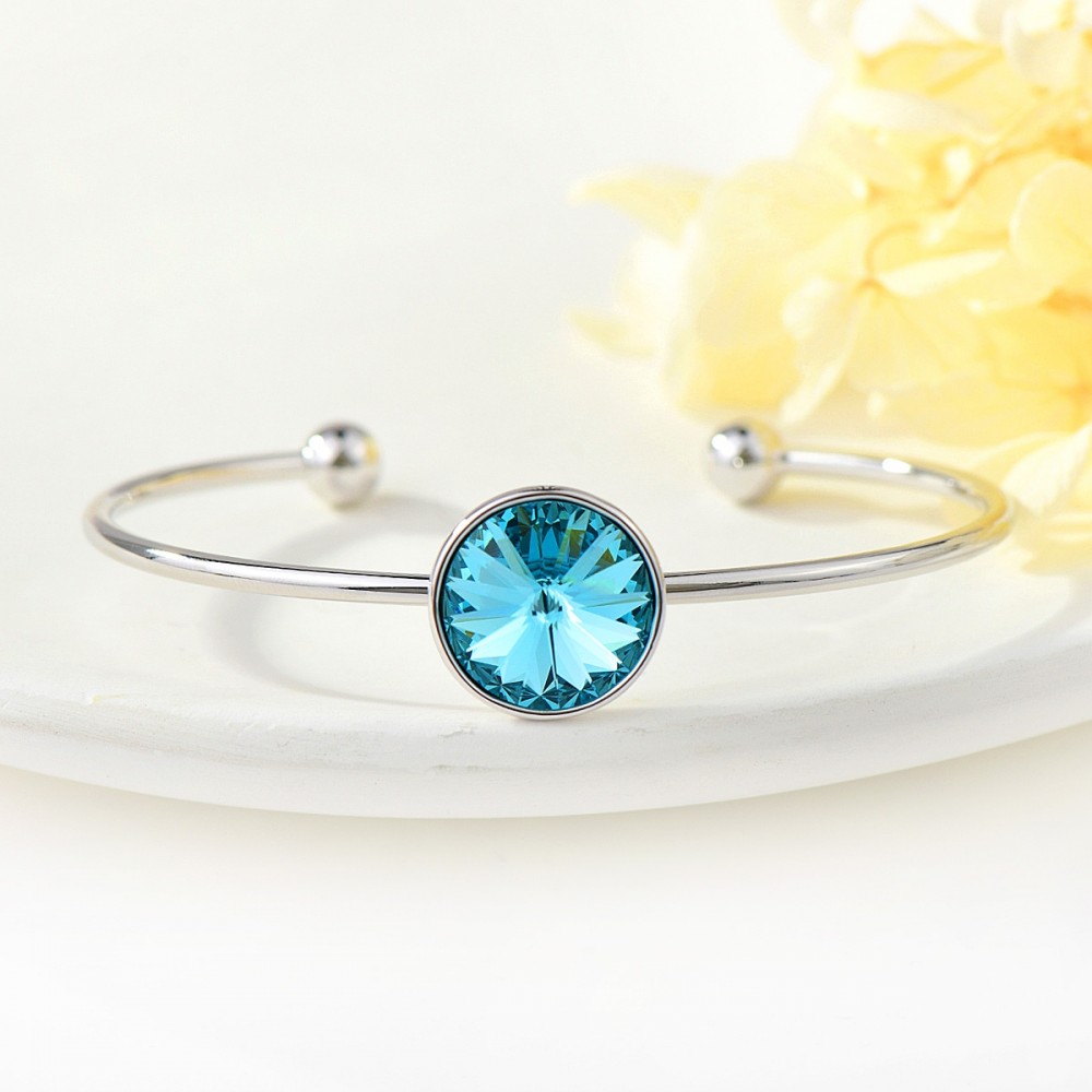 Image of Nyitott, merev karkötő türkizkék kör alakú Swarovski kristállyal (0433.)