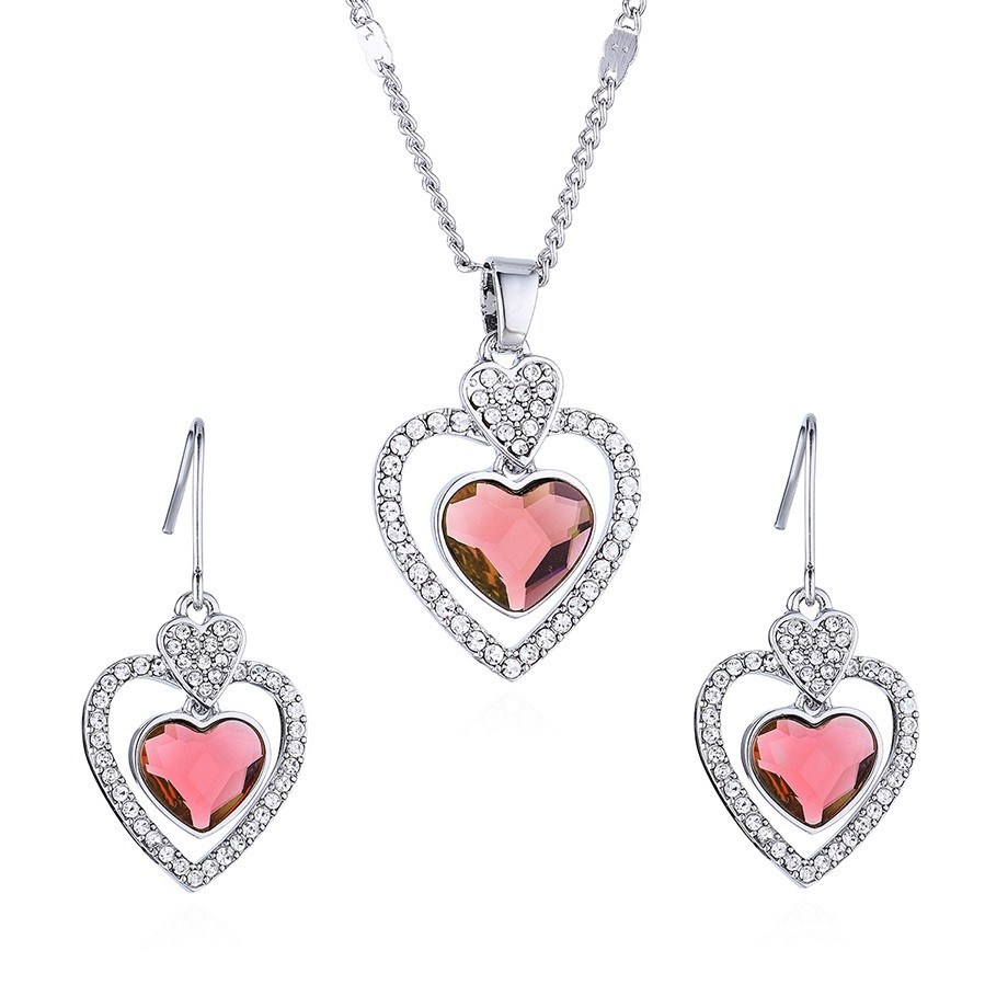 Image of Ródiummal bevont elegáns szív ékszerszett mályvaszínű Swarovski kristállyal (0067.)