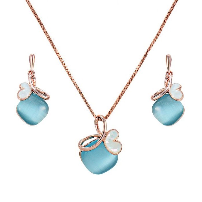 Image of Rózsaarannyal bevont rombusz ékszerszett kék macskaszem opálokkal (0213.)