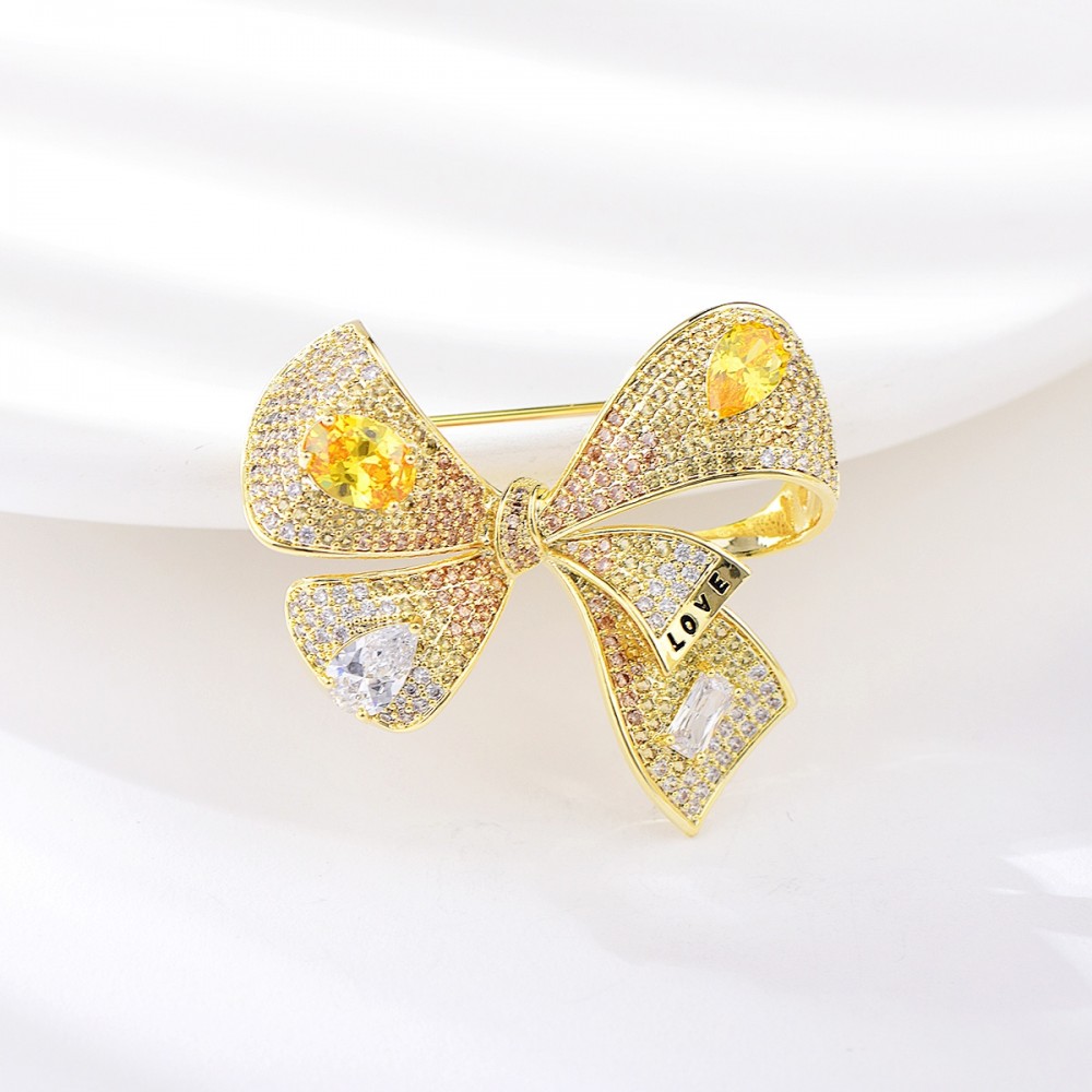 Image of Arannyal bevont masni bross áttetsző és pezsgőszínű CZ kristályokkal (0223.)